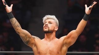 AEW wrestler Kip Sabian with his hands raised up