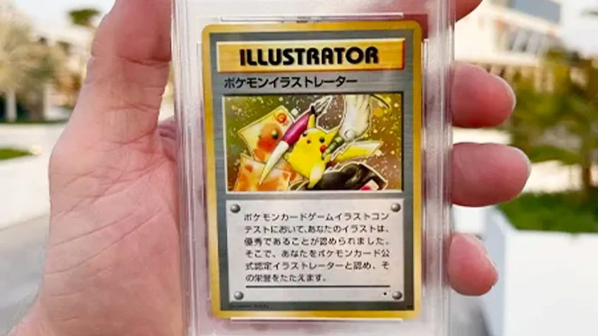 Loan Paul holding his PSA 10 Pikachu Illustrator